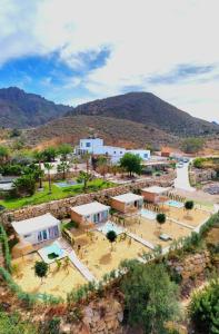 an aerial view of a village with mountains in the background at B&B La Nava Suites in Mojácar