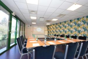 a conference room with a long table and chairs at Sure Hotel by Best Western Gemenos en Provence in Gémenos +54 photos