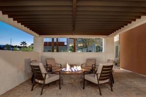 a patio with a fire pit and chairs around it at Home2 Suites By Hilton Las Vegas Southwest I-215 Curve in Las Vegas