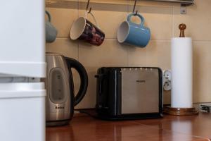 a kitchen counter with a toaster and a microwave at 27 Gdynia Centrum - Apartament Mieszkanie dla 2 os in Gdynia