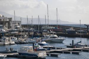 a bunch of boats docked in a harbor at WelcomeBuddy - Casa Rua da Fonte in Ponta Delgada