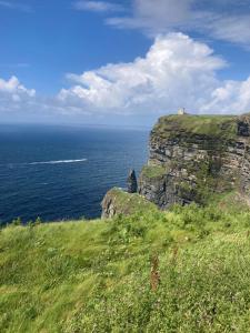 a view of the ocean from a cliff at Luxury Country Escape in Ennis