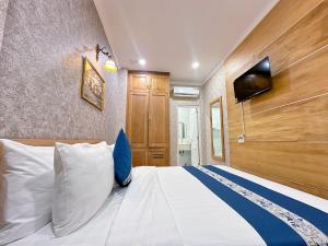 Giường trong phòng chung tại Tra My Hotel - SaiGon Center