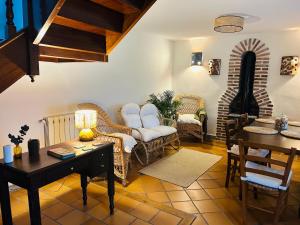 a living room with a couch and a table at Pensión Casa Arenas in Arenas de Cabrales