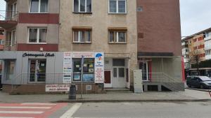 a building on the corner of a street at Ego Residence Alba Iulia in Alba Iulia