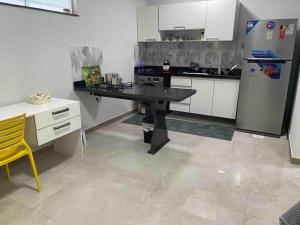 Una cocina o cocineta en 4 Conforto em Manaus