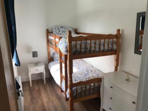 Ένα ή περισσότερα κρεβάτια σε δωμάτιο στο Sarahs Beachouse