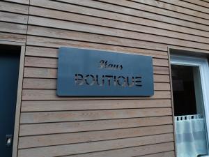 a sign for a store on the side of a building at Haus Boutique in Bad Salzuflen