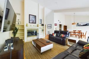 a living room with a couch and a fireplace at San Jose 2br w driveway balcony nr Bart SFO-1619 in San Jose