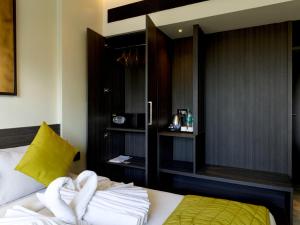 Ariya Nivaas A Vegetarian Hotel客房内的一张或多张床位