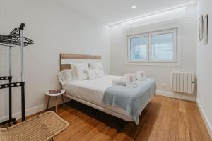 Ένα ή περισσότερα κρεβάτια σε δωμάτιο στο Petit Luxe Pineda +63 φωτογραφίες