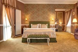 a bedroom with a large bed in a room at Villa Boutique Lafayette in Bucharest