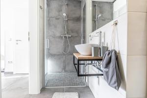 Koupelna v ubytování Krems Bahnhof Deluxe Rooms - near Danube River + 37 fotografií