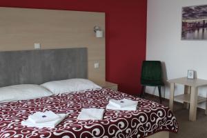 Postel nebo postele na pokoji v ubytování Apartments Verona Karlovy Vary