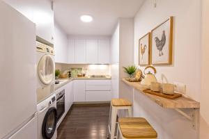 Kuchyňa alebo kuchynka v ubytovaní Genteel Home Larios