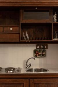 a kitchen with a sink and a counter top at Birrificio del Catria in Cantiano