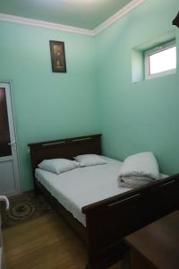 Postel nebo postele na pokoji v ubytování Tnak Hotel