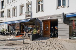 a store front of a building on a city street at Urban Retreat - City Center Apartment in central Berlin BY HOMELY in Berlin