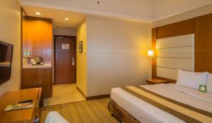 Postel nebo postele na pokoji v ubytování Pearl View Hotel Prai, Penang