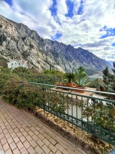 a balcony with a view of a mountain at GREEN VILLAGE Apartment in Gornji Orahovac