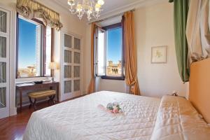 Posteľ alebo postele v izbe v ubytovaní Serristori Palace Residence