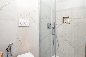 a bathroom with a shower and a toilet at Giglio in Volastra +23 photos