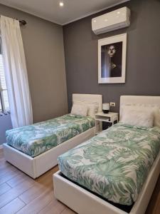 Posteľ alebo postele v izbe v ubytovaní Home K&Y - Aurelio