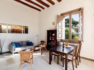 a living room with a table and a couch at Vilaseca apartment with private terrace in La Torre de Claramunt