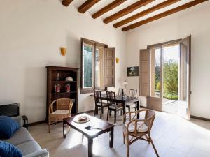 a living room with a couch and a table at Vilaseca apartment with private terrace in La Torre de Claramunt