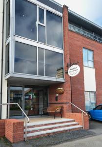 a building with a bench in front of it at Bannview Bed & Breakfast in Portadown