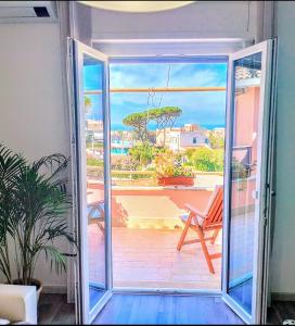 an open door with a view of a patio at Anzio Paradise in Anzio
