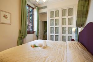 Posteľ alebo postele v izbe v ubytovaní Serristori Palace Residence