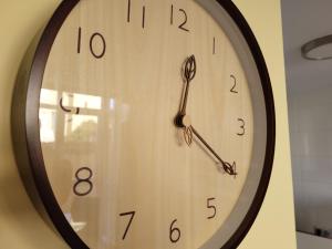 a clock is hanging on a wall at La Morada del Arcipreste in Guadalajara +37 photos