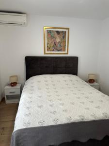 Ένα ή περισσότερα κρεβάτια σε δωμάτιο στο Double room apartment Tomas