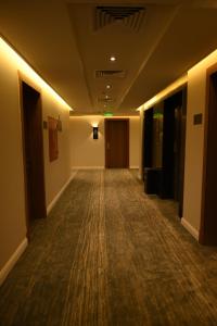 a hallway of an office building with a long hallwayngth at Villa Misk Dammam in Dammam