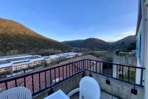 a balcony with chairs and a view of mountains at Les Naïades G37- 2 bedrooms for 5 people ! in Avène +6 photos