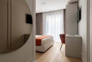 TV a/nebo společenská místnost v ubytování Le Terrazze Suites