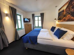 Postel nebo postele na pokoji v ubytování Pension Jitřenka Hřensko Bed & Breakfast + 37 fotografií