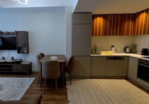 a kitchen with a table and a dining room at Luxurious Downtown Apartment 143 in Istanbul
