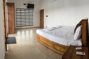 Ένα ή περισσότερα κρεβάτια σε δωμάτιο στο JMJ Riverview Homestay