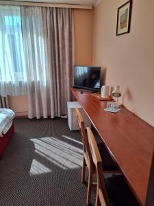 Łóżko lub łóżka w pokoju w obiekcie Karet Obiekt Hotelowy