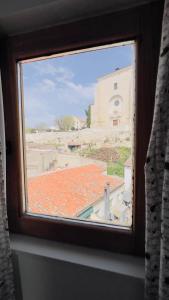 a window with a view of a building at APCH V7 Torreón in Chinchón