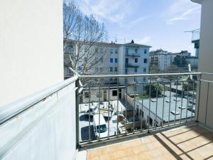 an apartment balcony with a view of a parking lot at Realkasa Creti Apartment in Bologna