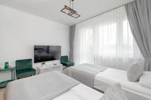 Llit o llits en una habitació de Comfortable Apartment with Balcony in Krakow by Rent like home