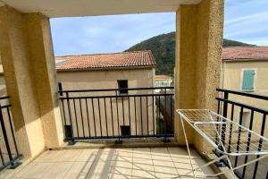 a balcony with a view of a building at Les Naïades I50 - 2 bedrooms for 5 people ! in Avène