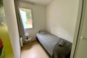 a small bedroom with a bed and a window at Les Naïades I53 - 2 bedrooms for 5 people ! in Avène