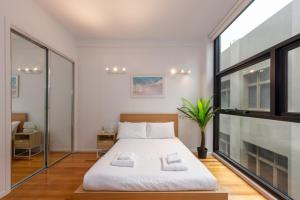 מיטה או מיטות בחדר ב-Stylish 3-bed Unit in the Heart of Melbourne CBD!