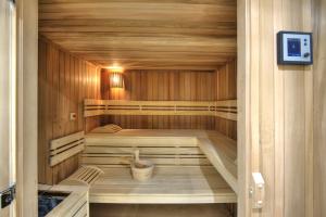 a sauna with wooden walls and a wooden floor at La Bastide de l'Oliveraie in Cannes