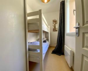 a bunk bed in a room with a ladder at Les Naïades C08 - 2 bedrooms for 5 people ! in Avène