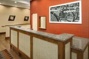 a lobby with a large picture of a motorcycle on the wall at Hampton Inn and Suites Clayton/St. Louis-Galleria Area in Clayton